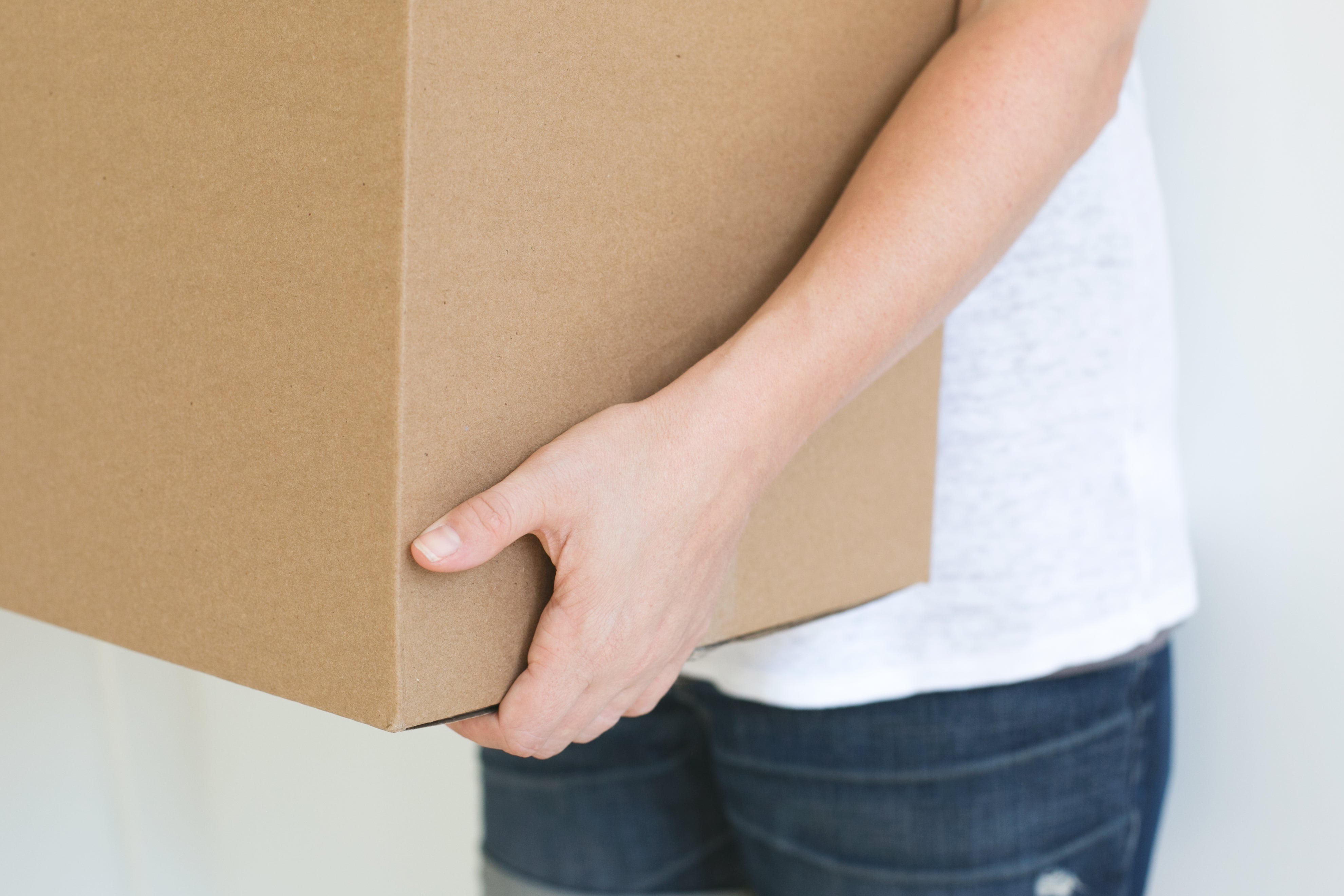 Customer holding delivery box – Beyond Bricks fast and reliable worldwide shipping.